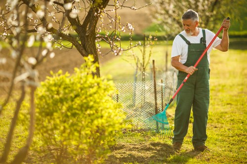 Safe working practices and PPE in use on a garden site